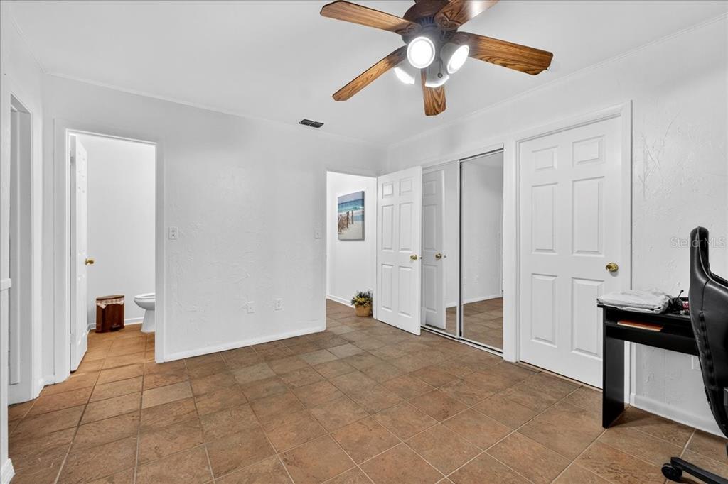 1501 North Combee Road Lakeland, FL 33801 - Photo 17 of 34 a view of a livingroom with a ceiling fan and entryway