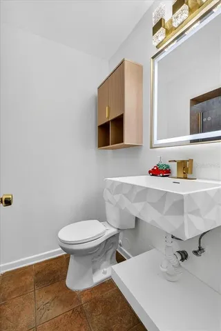 a bathroom with a sink and a toilet