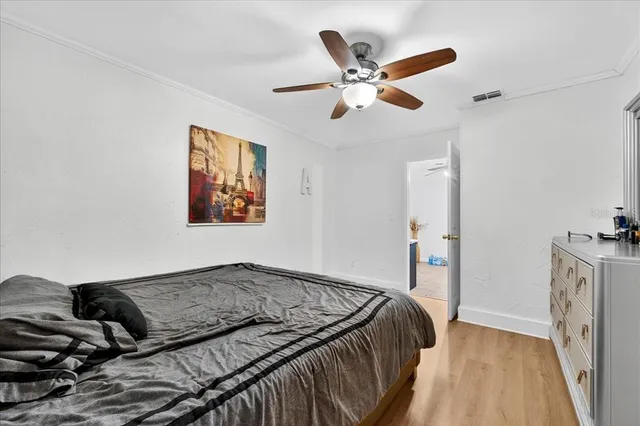 a living room with a bed furniture and a fireplace