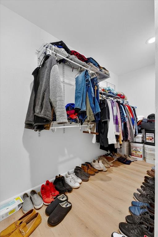 1501 North Combee Road Lakeland, FL 33801 - Photo 26 of 34 a view of walk in closet with clothes and shoes
