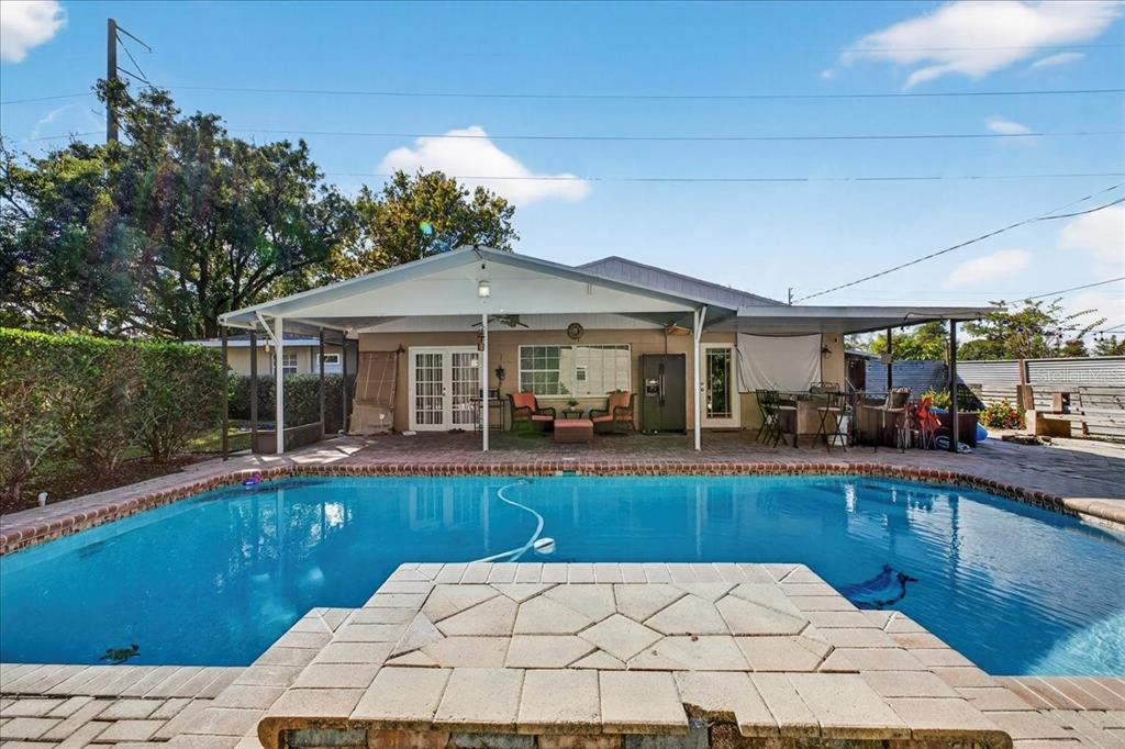 1501 North Combee Road Lakeland, FL 33801 - Photo 30 of 34 a view of a house with swimming pool and sitting area