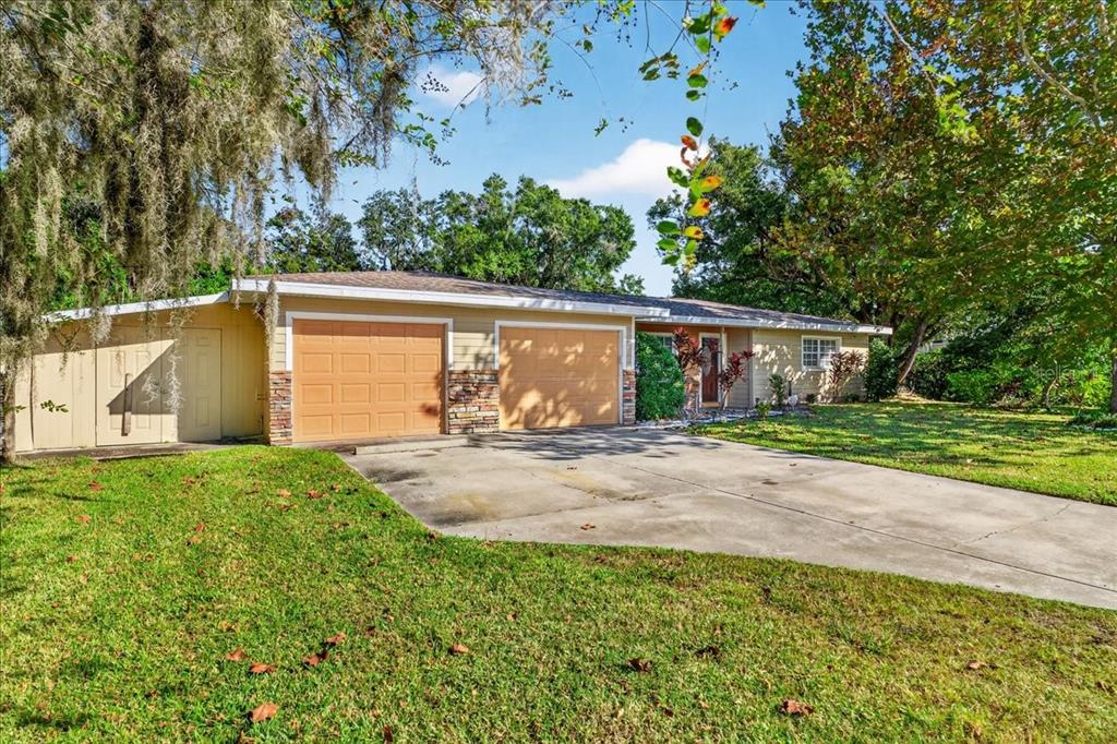 1501 North Combee Road Lakeland, FL 33801 - Photo 3 of 34 front view of a house with a street