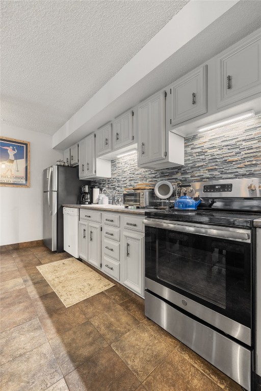 1179 Ski Hill Road, Unit 147 Breckenridge, CO 80424 - Photo 11 of 43 a kitchen with stainless steel appliances granite countertop a stove and white cabinets