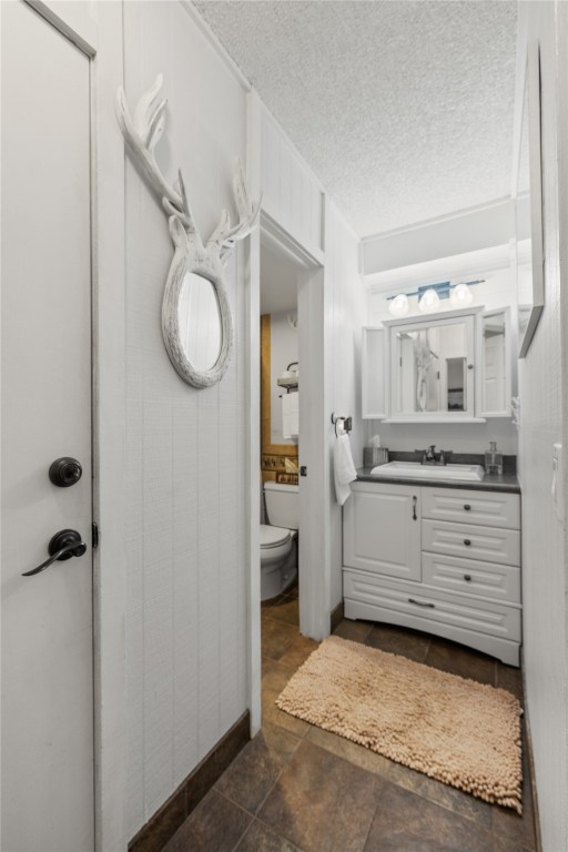 1179 Ski Hill Road, Unit 147 Breckenridge, CO 80424 - Photo 19 of 43 a bathroom with a granite countertop sink mirror and vanity
