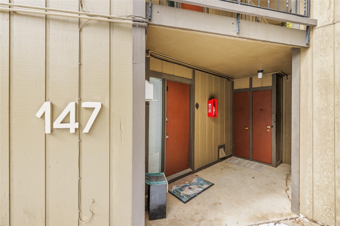 1179 Ski Hill Road, Unit 147 Breckenridge, CO 80424 - Photo 24 of 43 a view of a hallway with wooden shelves