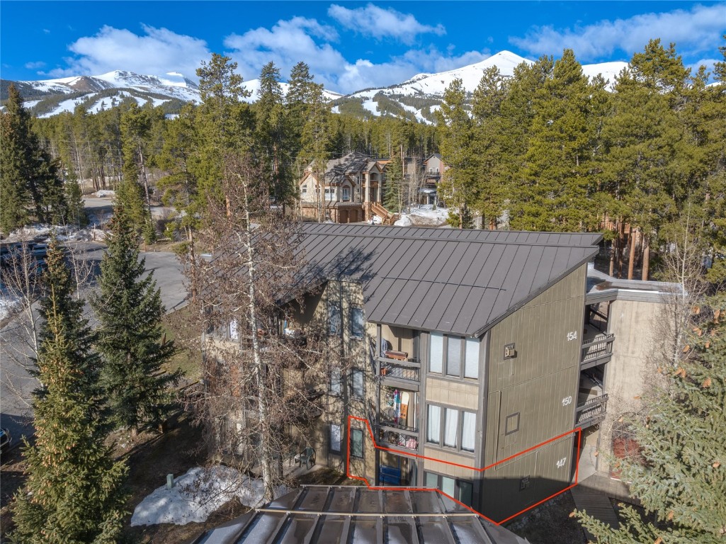 1179 Ski Hill Road, Unit 147 Breckenridge, CO 80424 - Photo 33 of 43 a view of a house with a yard