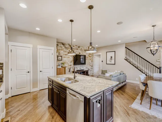 a living room with fireplace furniture and a flat screen tv