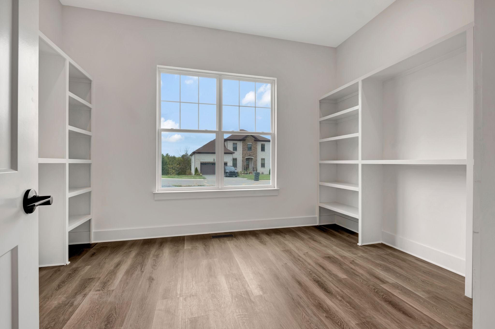 808 Saddle Ridge Drive Old Hickory, TN 37138 - Photo 13 of 39 a view of an empty room with a window and wooden floor