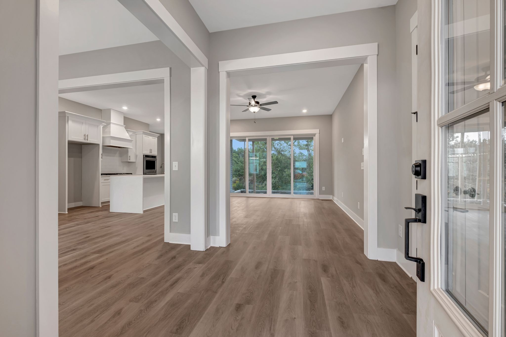 808 Saddle Ridge Drive Old Hickory, TN 37138 - Photo 3 of 39 a view of a big room with wooden floor and a kitchen