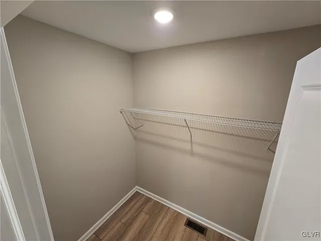 a view of a room with racks on the wall