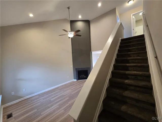 wooden floor in an empty room with stairs