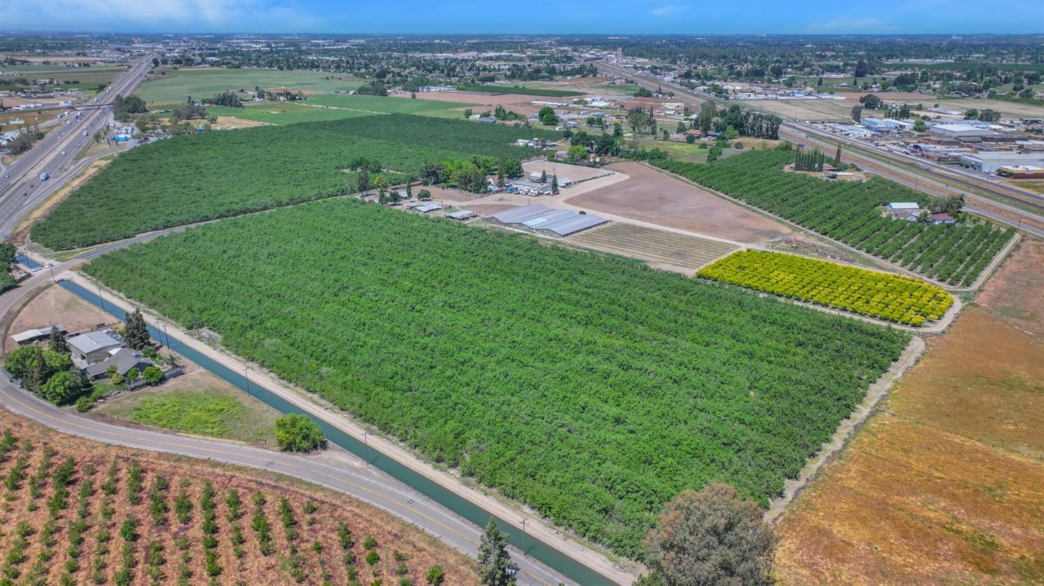 Overhead view of 2818 Youngstown Rd.(7 acres), Stanislaus Co. and 3818 Youngstown Re. (11.7 acres)in Merced Co.  both listed separately.  Boundary line is diagonal through property.