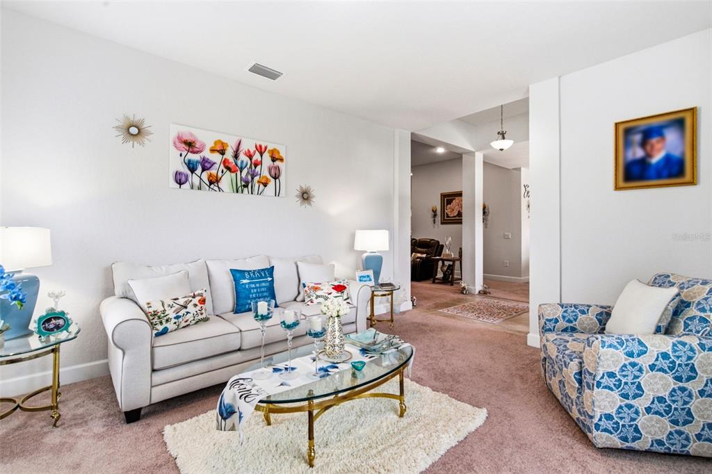 12181 Topaz Street Spring Hill, FL 34608 - Photo 11 of 71 a living room with furniture and wooden floor