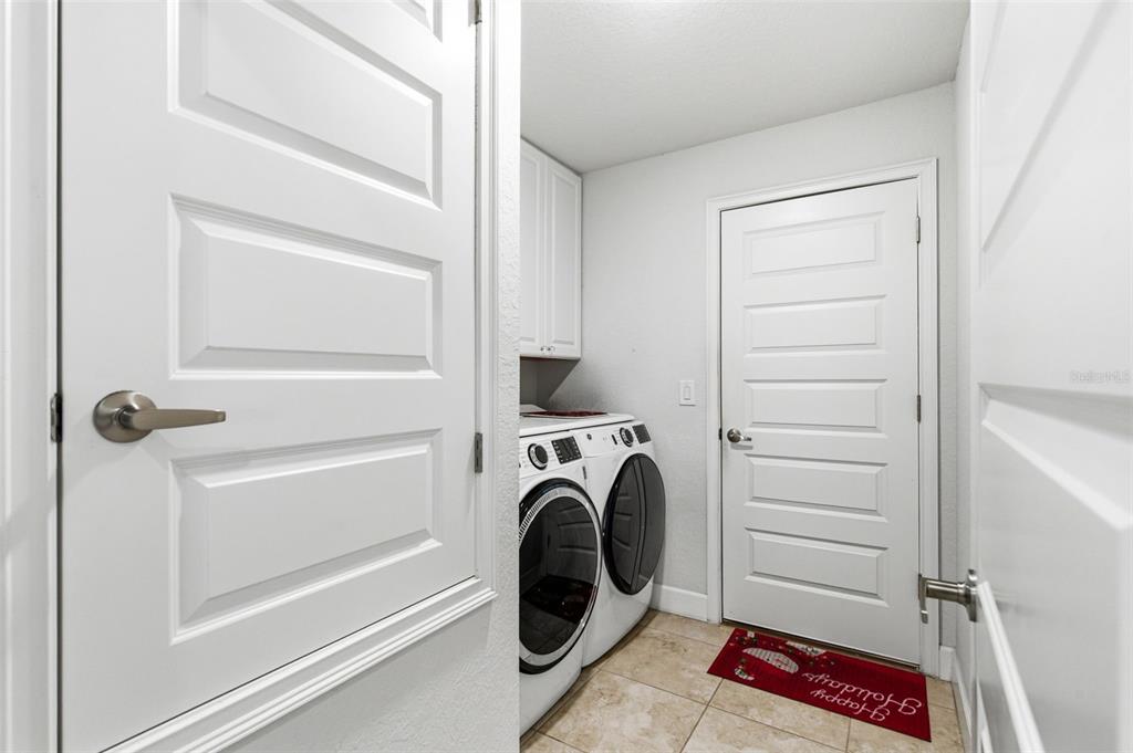 12181 Topaz Street Spring Hill, FL 34608 - Photo 25 of 71 a view of walk in closet with clothes and shoes