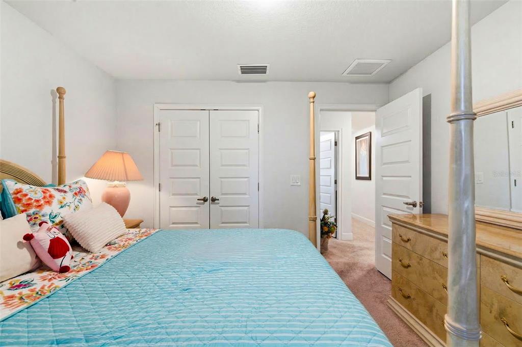 12181 Topaz Street Spring Hill, FL 34608 - Photo 29 of 71 a bedroom with furniture and wooden floor