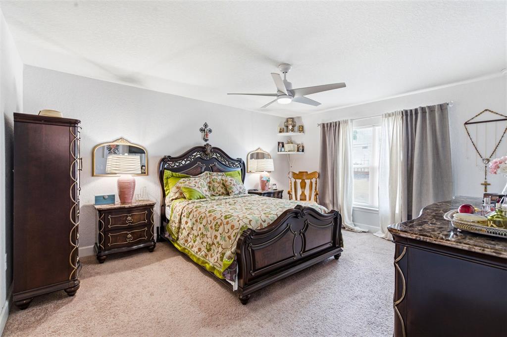 12181 Topaz Street Spring Hill, FL 34608 - Photo 34 of 71 a bedroom with a bed dresser and a window