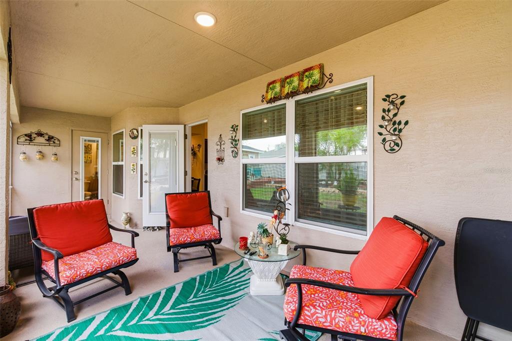 12181 Topaz Street Spring Hill, FL 34608 - Photo 45 of 71 a outdoor living space with furniture and a flat screen tv