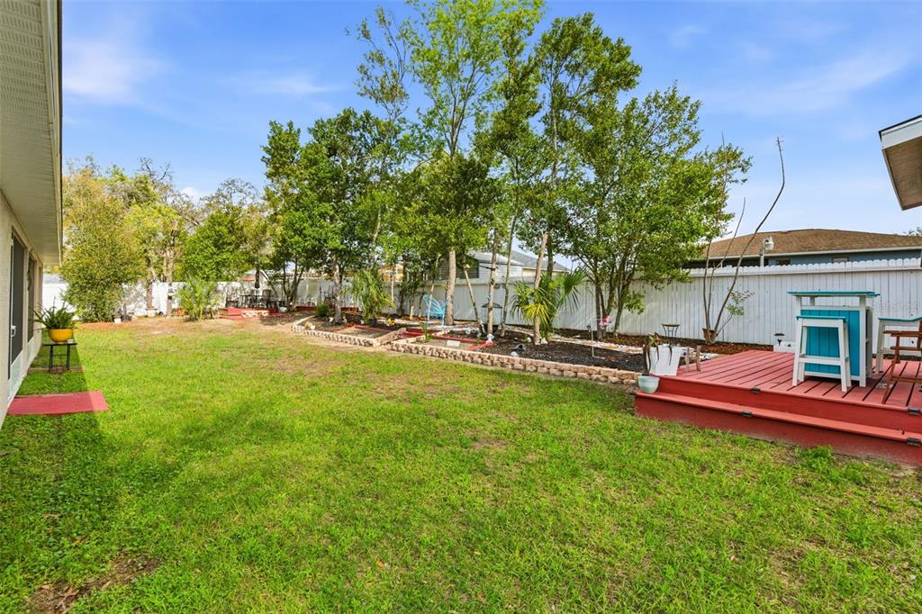 12181 Topaz Street Spring Hill, FL 34608 - Photo 48 of 71 a view of a house with a yard porch and sitting area