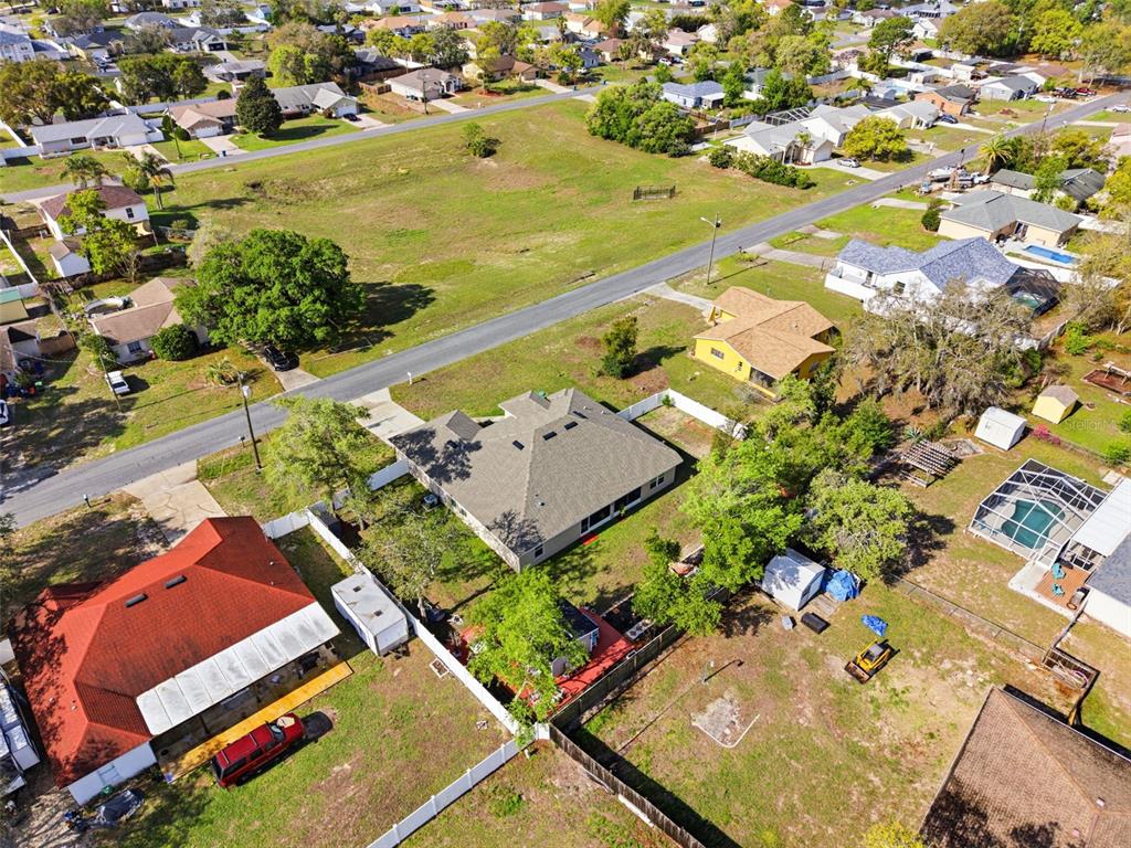 12181 Topaz Street Spring Hill, FL 34608 - Photo 59 of 71 an aerial view of residential houses with outdoor space