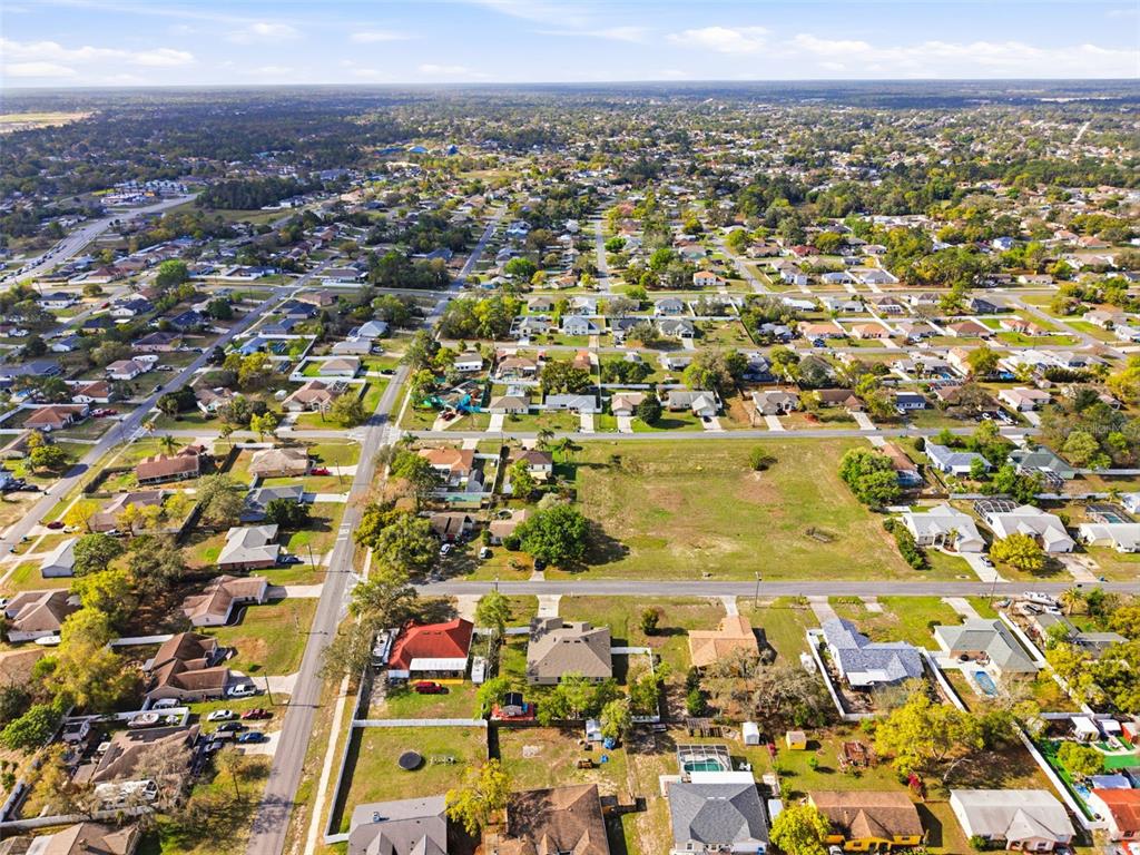 12181 Topaz Street Spring Hill, FL 34608 - Photo 67 of 71 an aerial view of residential houses with outdoor space