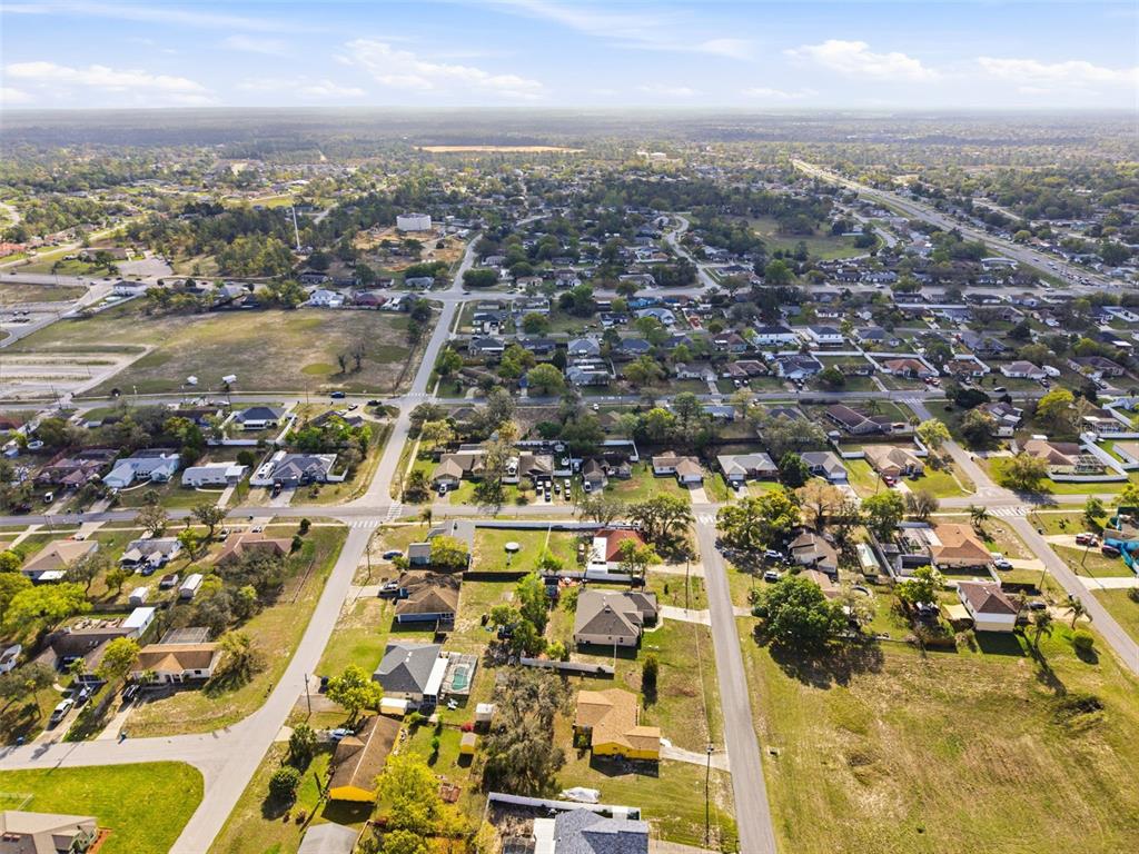 12181 Topaz Street Spring Hill, FL 34608 - Photo 68 of 71 an aerial view of residential building with parking space