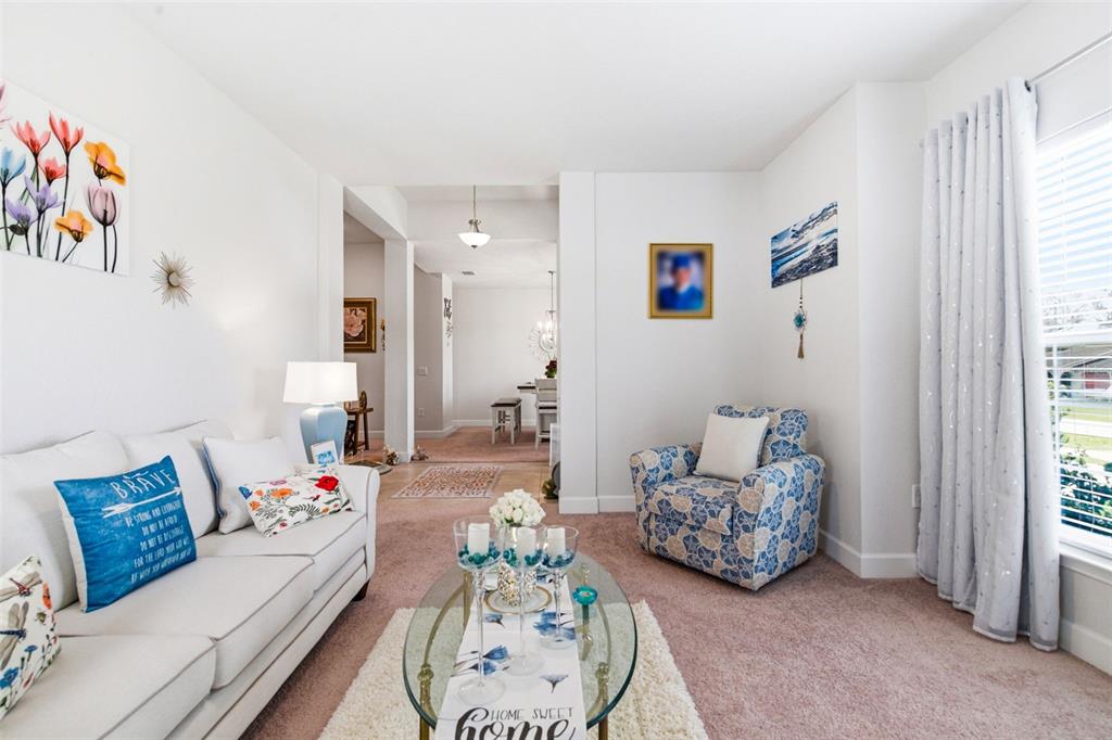 12181 Topaz Street Spring Hill, FL 34608 - Photo 10 of 71 a living room with furniture and a large window