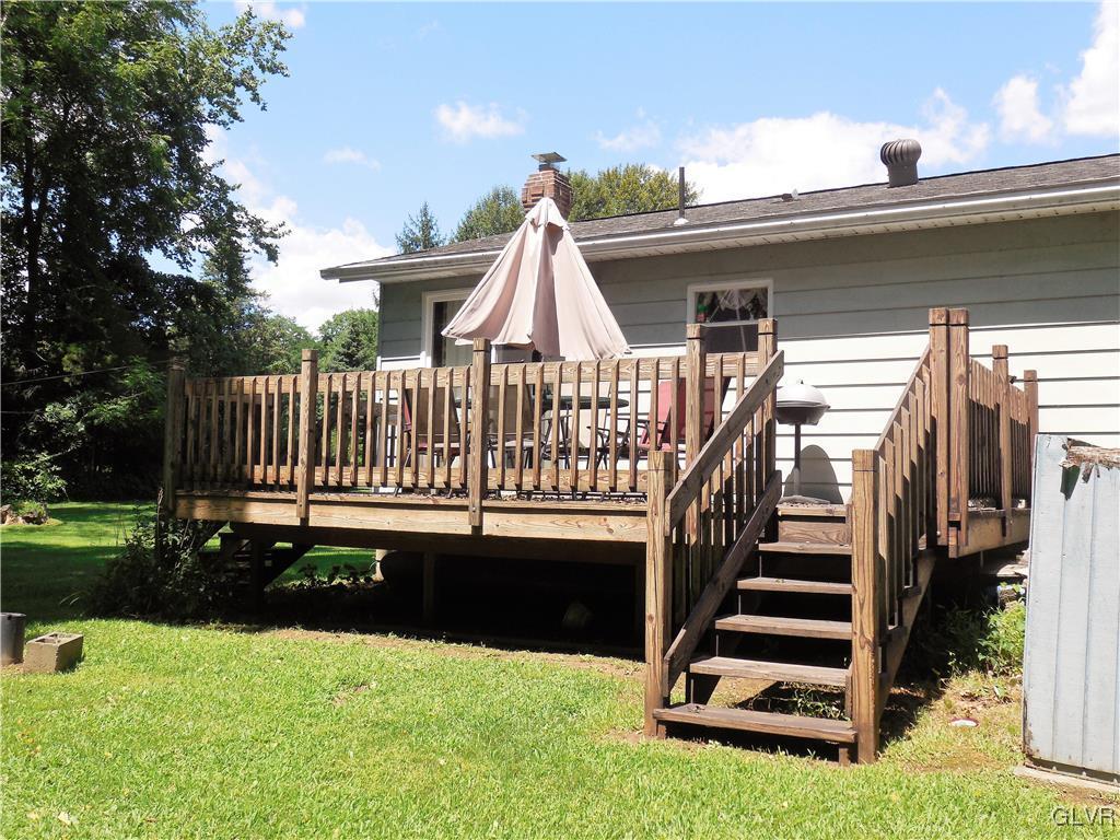 4893 Ostrander Road Bangor, PA 18013 - Photo 2 of 17 a view of swimming pool with deck and garden