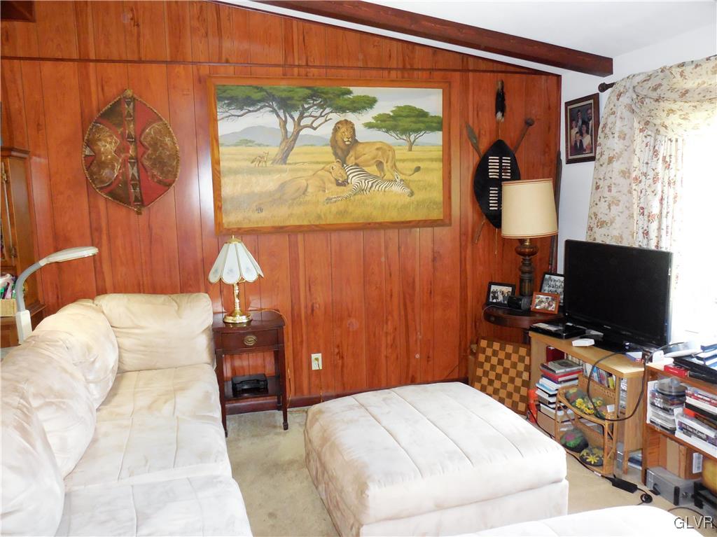 4893 Ostrander Road Bangor, PA 18013 - Photo 7 of 17 a bedroom with a bed and a flat screen tv