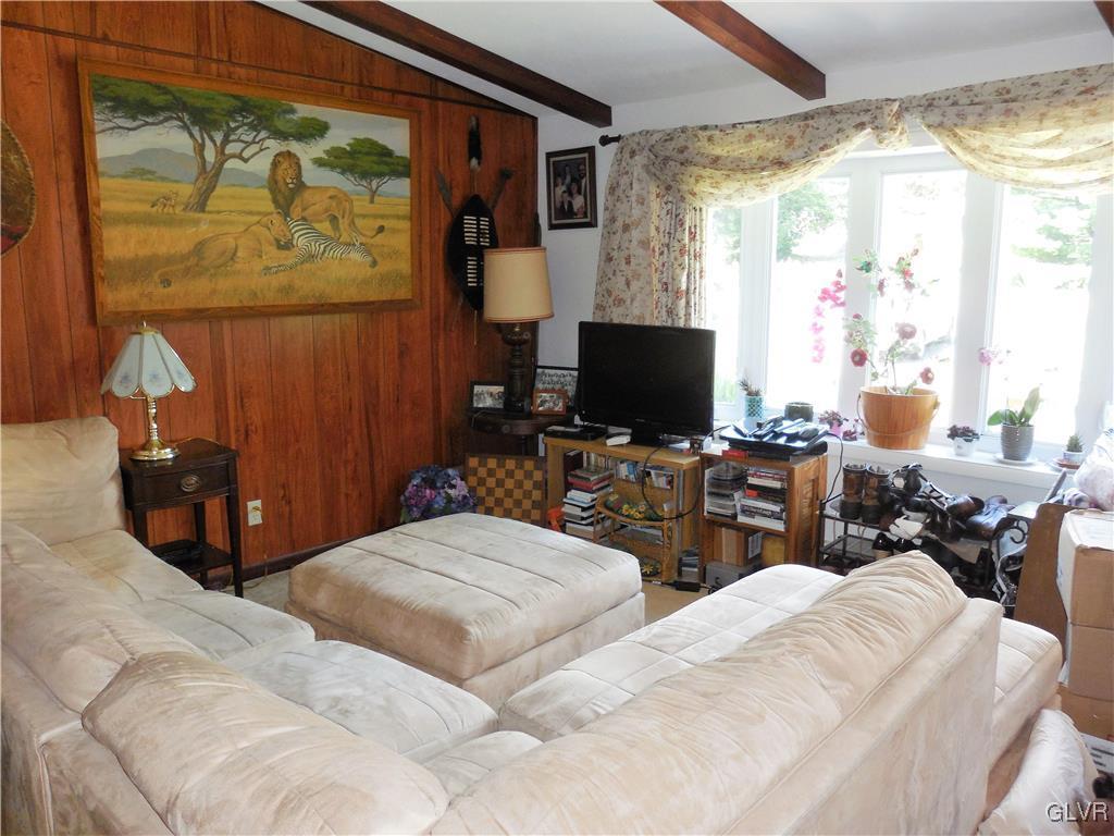 4893 Ostrander Road Bangor, PA 18013 - Photo 8 of 17 a bedroom with two beds and a window