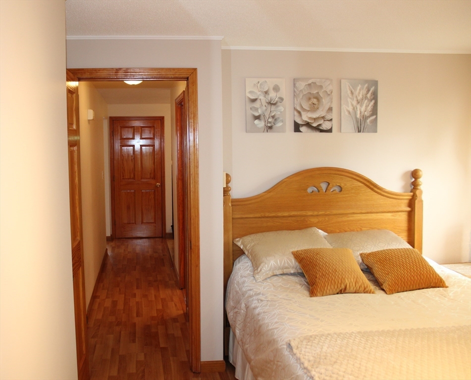 28 State Street Chicopee, MA 01013 - Photo 14 of 25 a bedroom with a bed and a window
