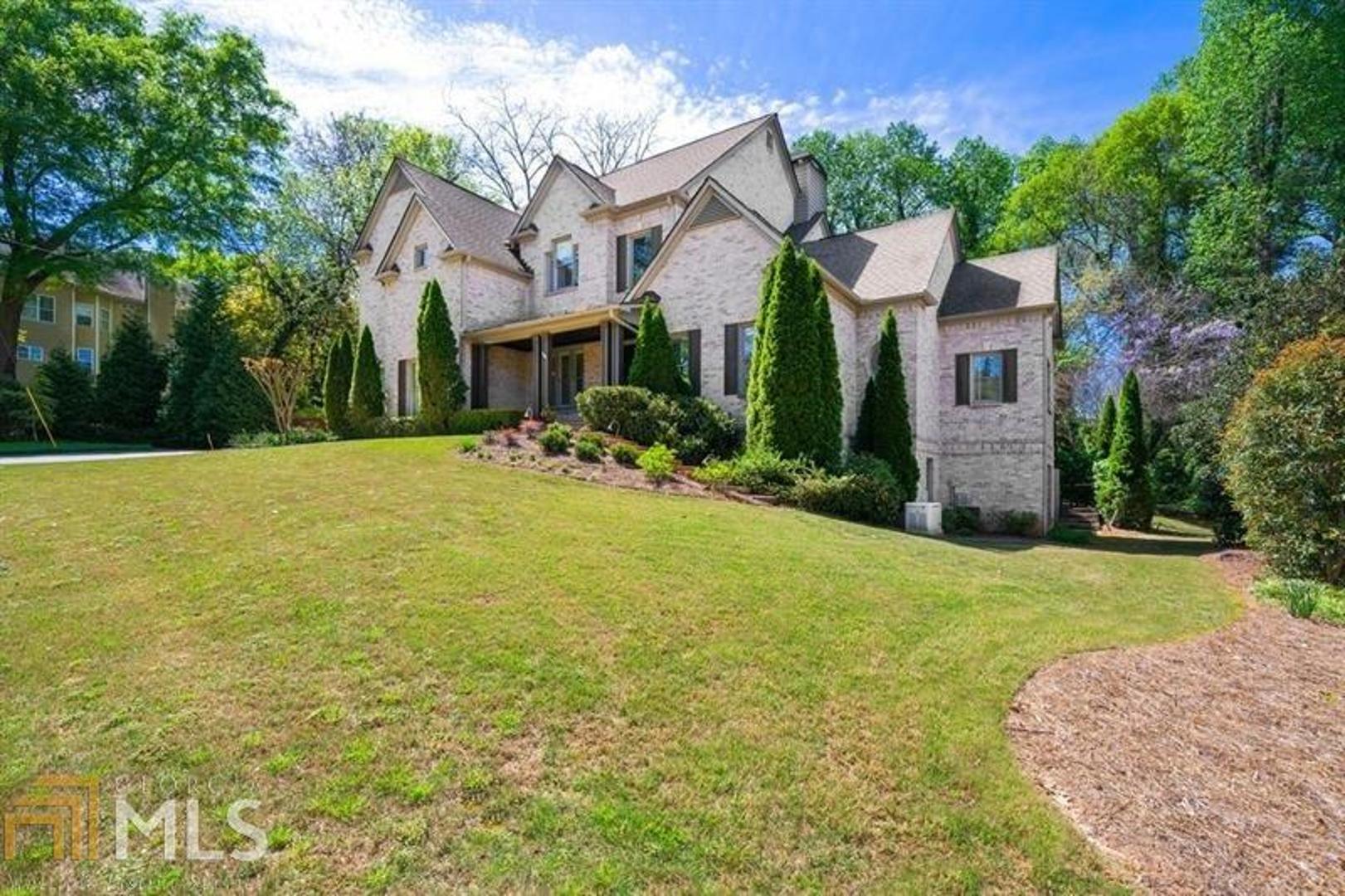 Exquisite Brookhaven home by Capital City Country Club, Town Brookhven premier shops and restaurants with a master on main, 3 car garage on the main a finished basement and a pool off the main.