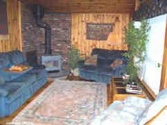 166 Merritt Road Otis, MA 01253 - Photo 2 of 11 a living room filled with furniture window and a table