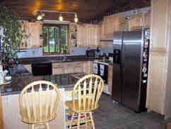 166 Merritt Road Otis, MA 01253 - Photo 4 of 11 a kitchen with a sink and refrigerator
