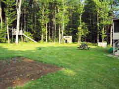 166 Merritt Road Otis, MA 01253 - Photo 8 of 11 a view of a park with swings and trees