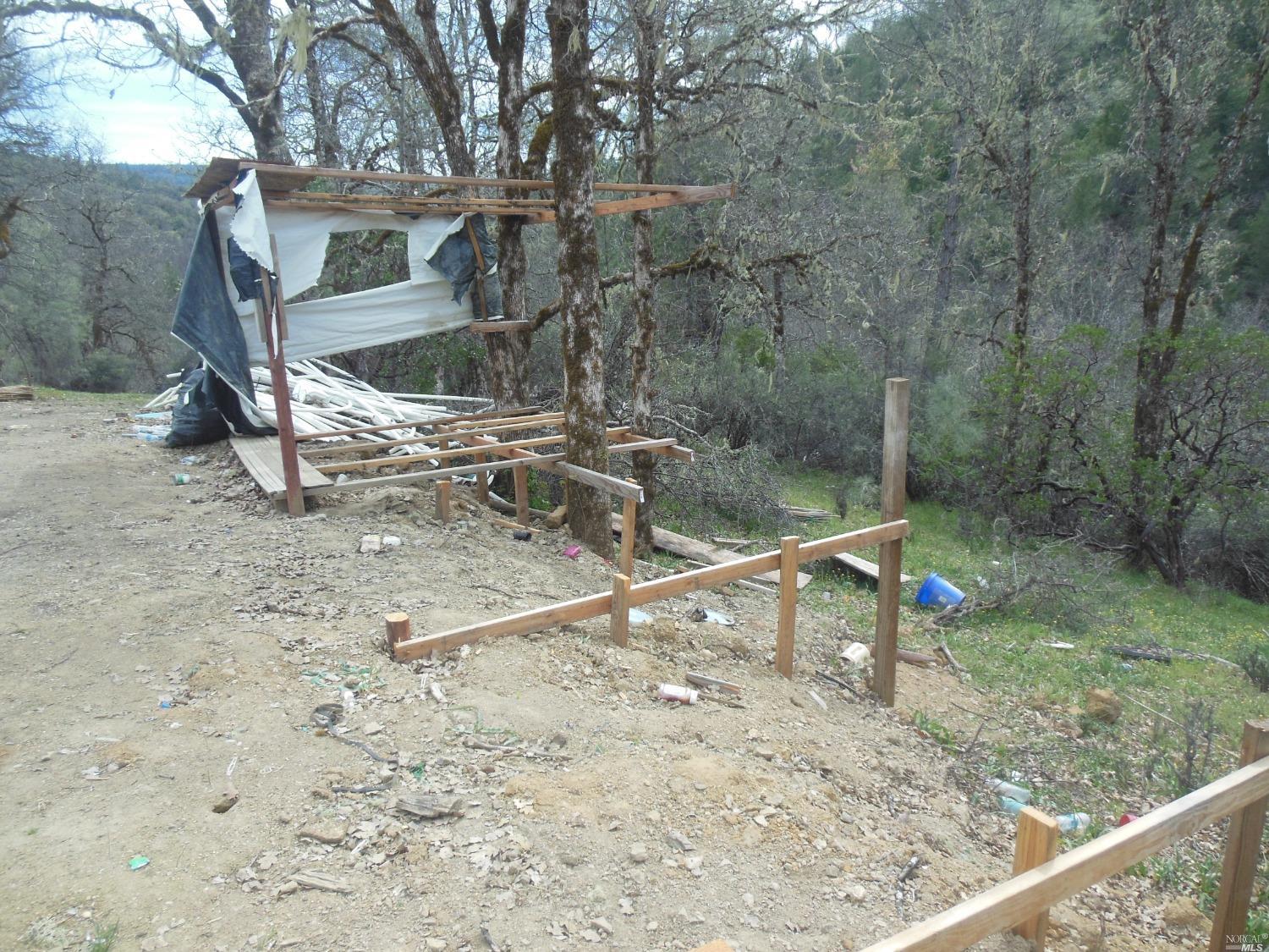 29700 Mendocino Pass Road Covelo, CA 95428 - Photo 22 of 27 a backyard of a house with table and chairs