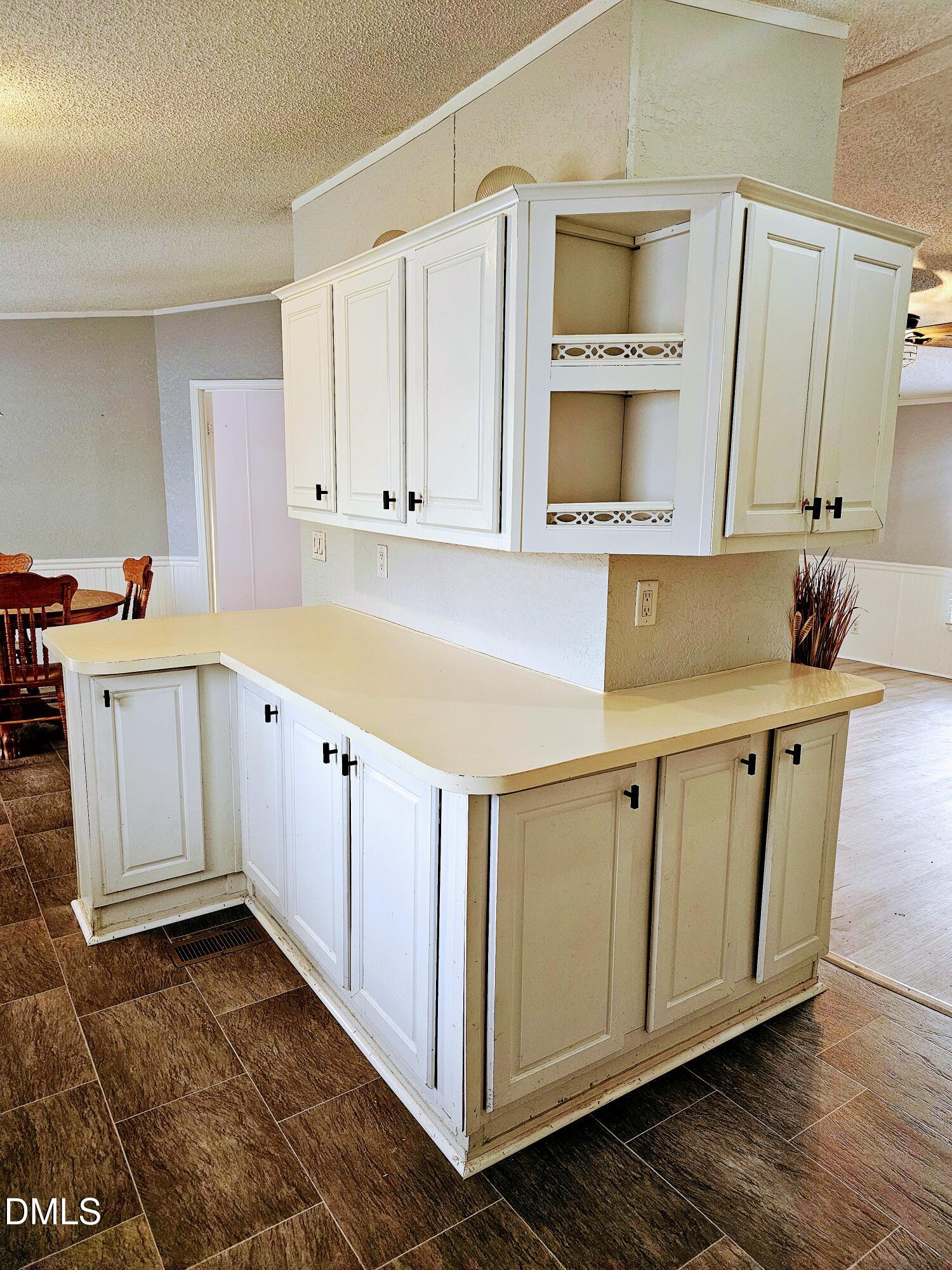 4762 Old Allensville Road Roxboro, NC 27574 - Photo 12 of 33 a view of a kitchen with cabinets