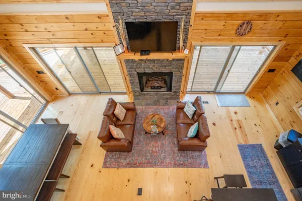 a bathroom with a granite countertop toilet and a sink