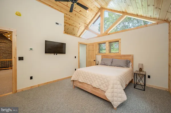 a view of a porch with wooden floor and fence