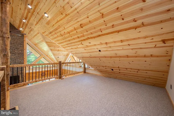 a kitchen with stainless steel appliances a stove and a shower