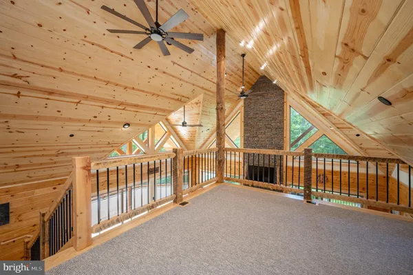 a bedroom with a large bed and a flat screen tv