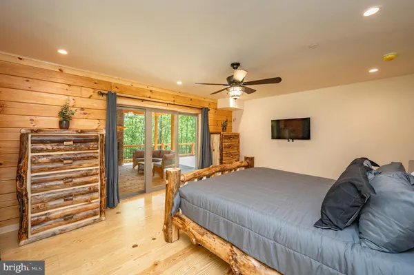 a bed sitting in a room next to a window