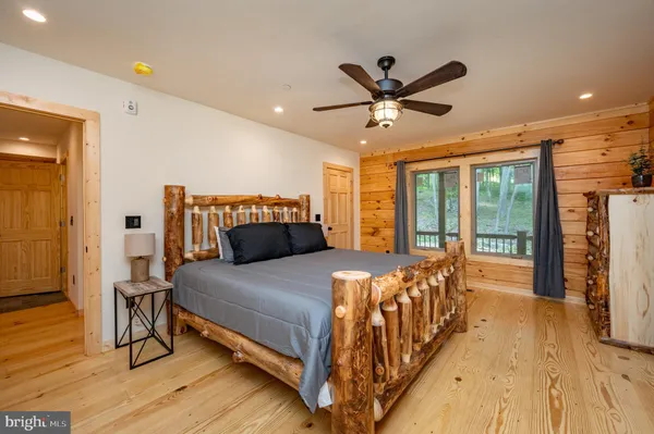 a white toilet sitting next to a shower curtain