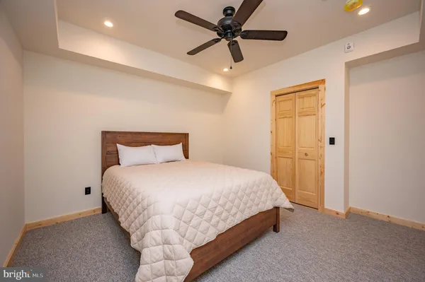 a room with furniture pool table and flat screen tv