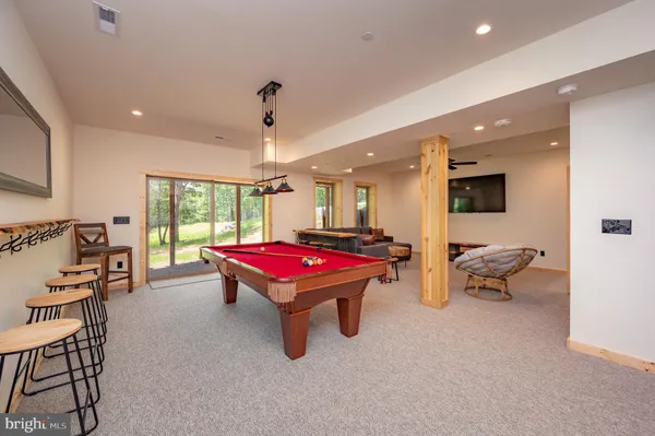 a view of a patio with a table and chairs