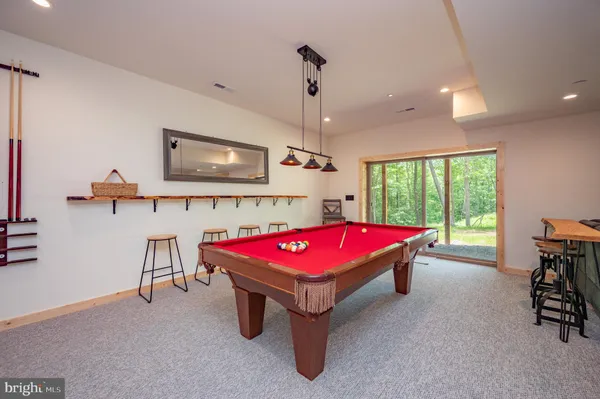 a table and chairs in patio of a house