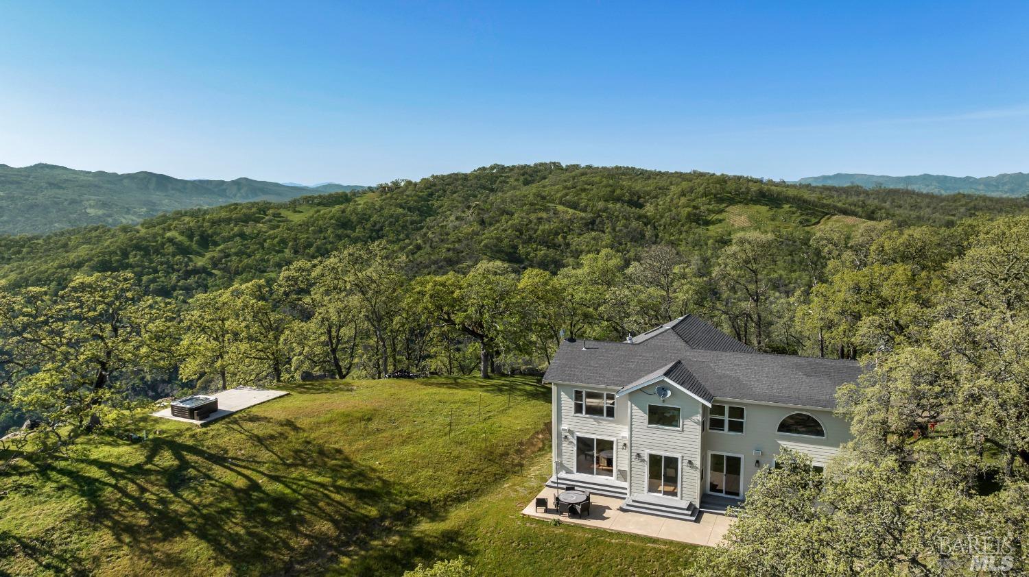 a aerial view of a house with a yard