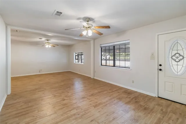 a view of an empty room with a window