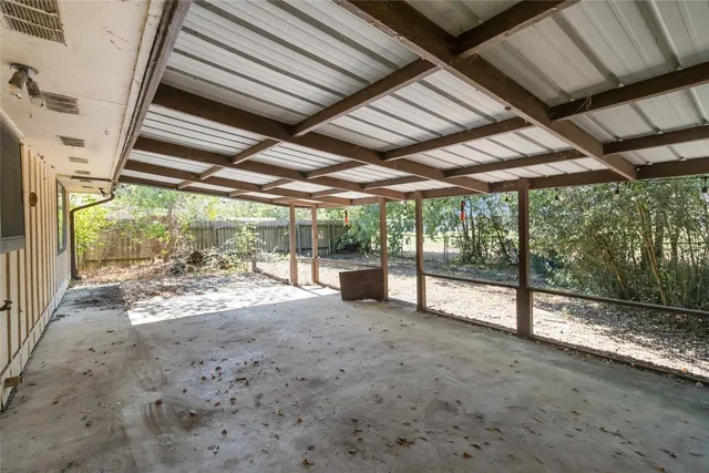 a view of a room with wooden walls