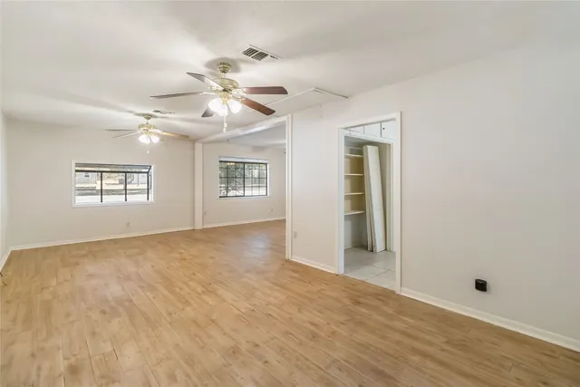 a view of an empty room with a window