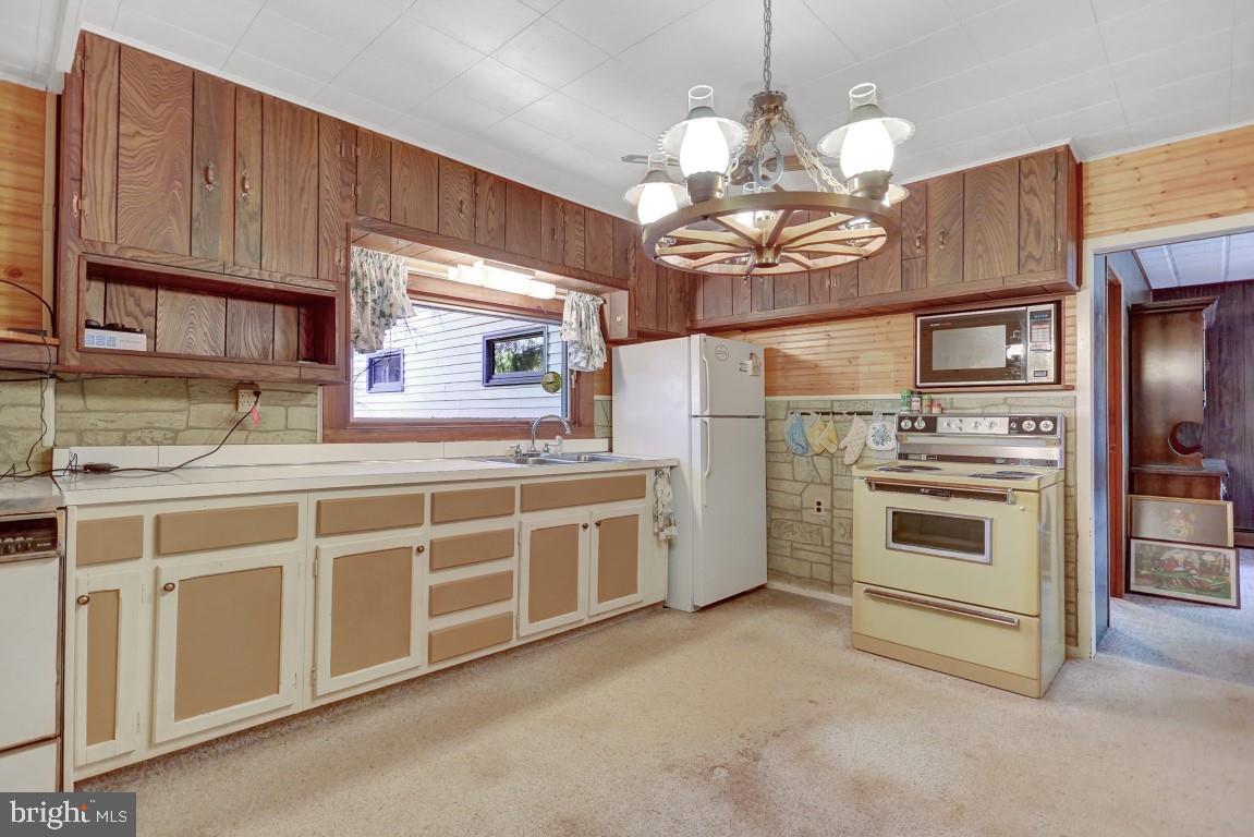 3475 Valley Road Marysville, PA 17053 - Photo 5 of 25 a kitchen with stainless steel appliances granite countertop a stove and cabinets